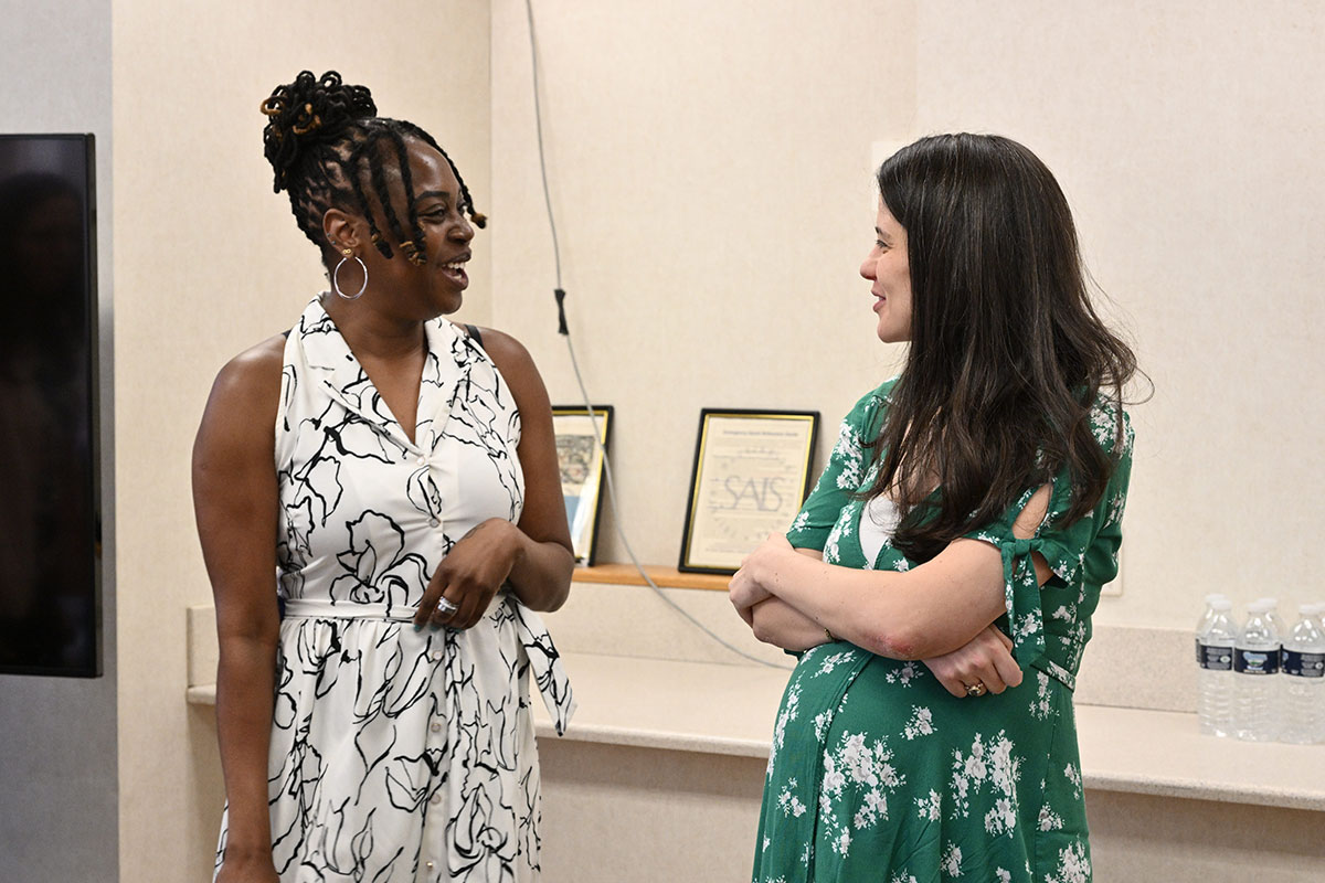 Two students discussing the MA in Sustainable Energy program