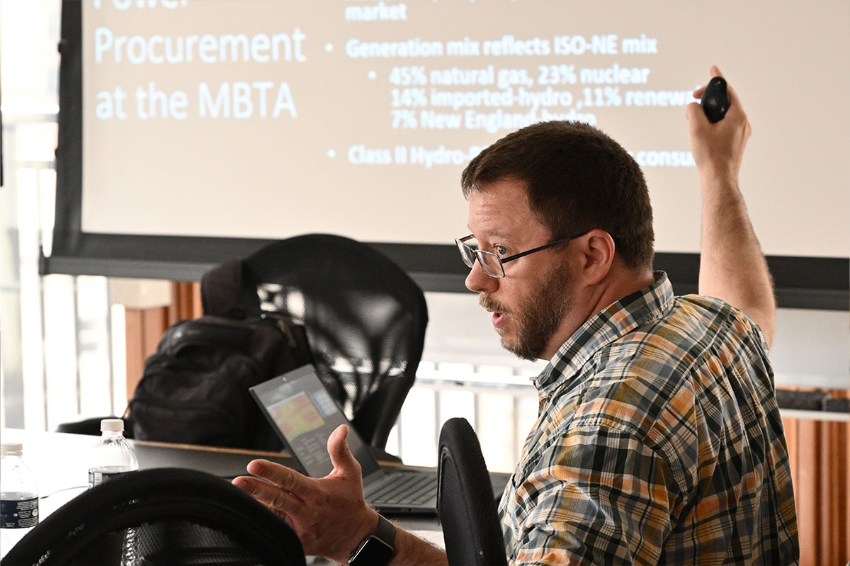 Group of SAIS students at a meeting with laptops